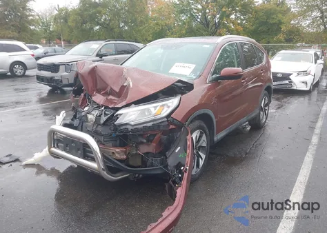 2015 Honda Cr-V Touring z USA, uszkodzony, nr VIN 5J6RM4H96FL120845